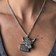 WESTERN ETCHED FLOWER COW PENDANT NECKLACE