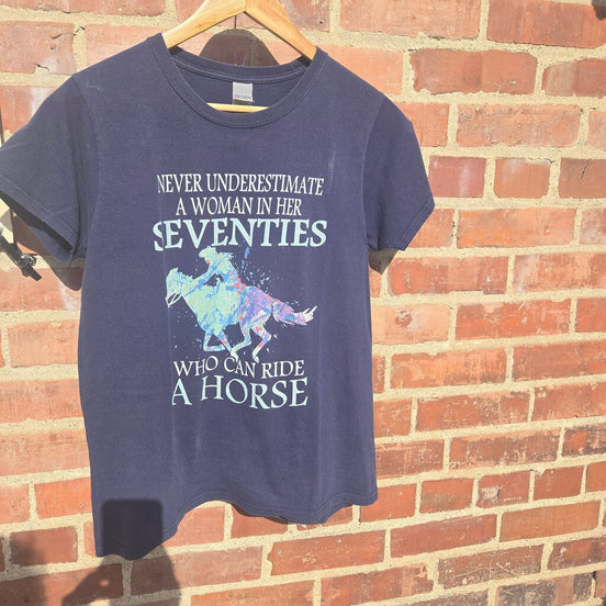 Never Underestimate A Woman In Her Seventies Graphic Tee